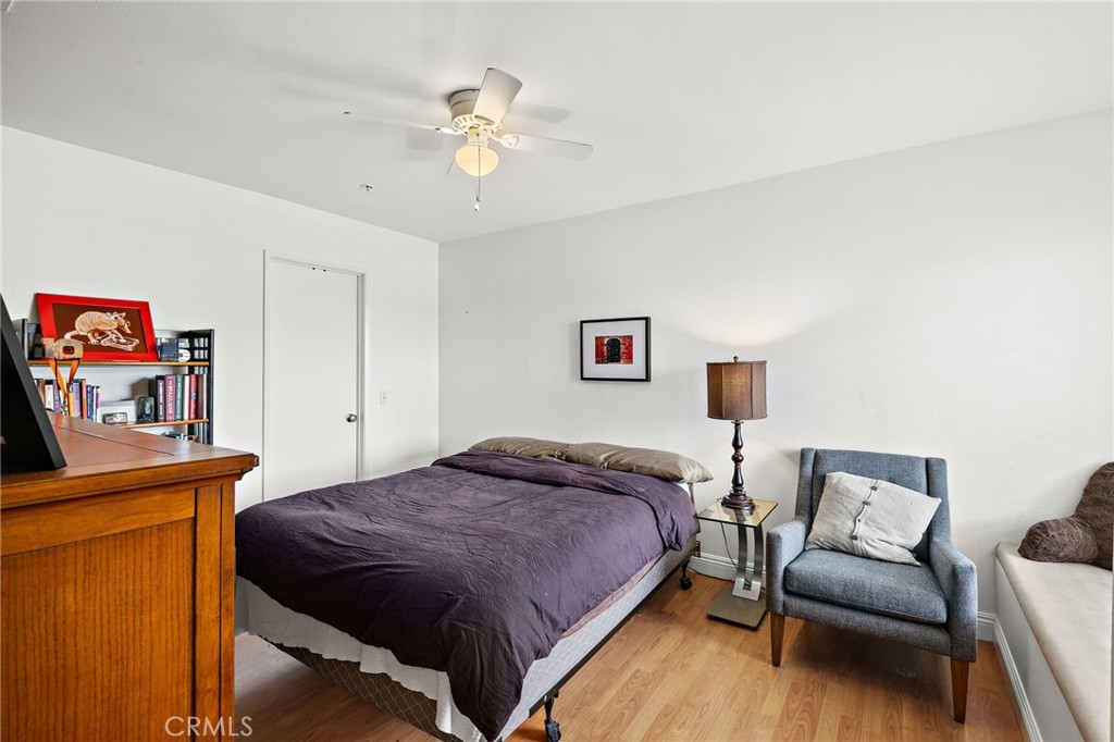 17641 Sergio Circle, Unit 203 Huntington Beach, CA 92647 - Photo 20 of 25 a bedroom with a bed and furniture