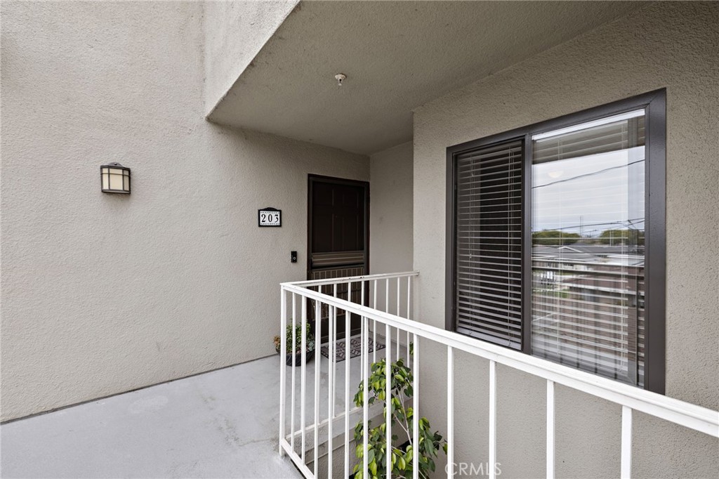 17641 Sergio Circle, Unit 203 Huntington Beach, CA 92647 - Photo 2 of 25 a view of a balcony