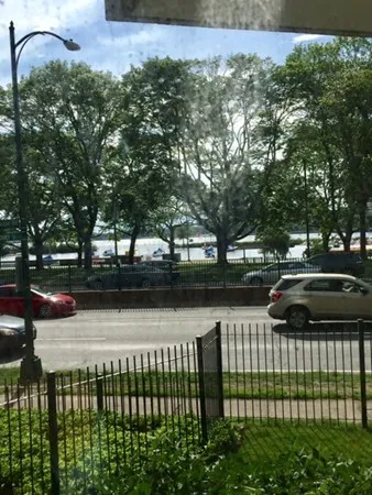 a view of street and bench