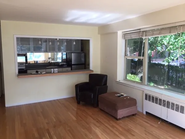 a living room with furniture and windows