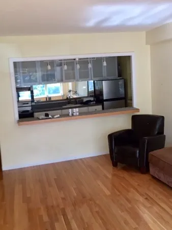 a living room with furniture and flat screen tv