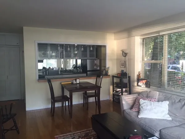 a dining room with furniture and window