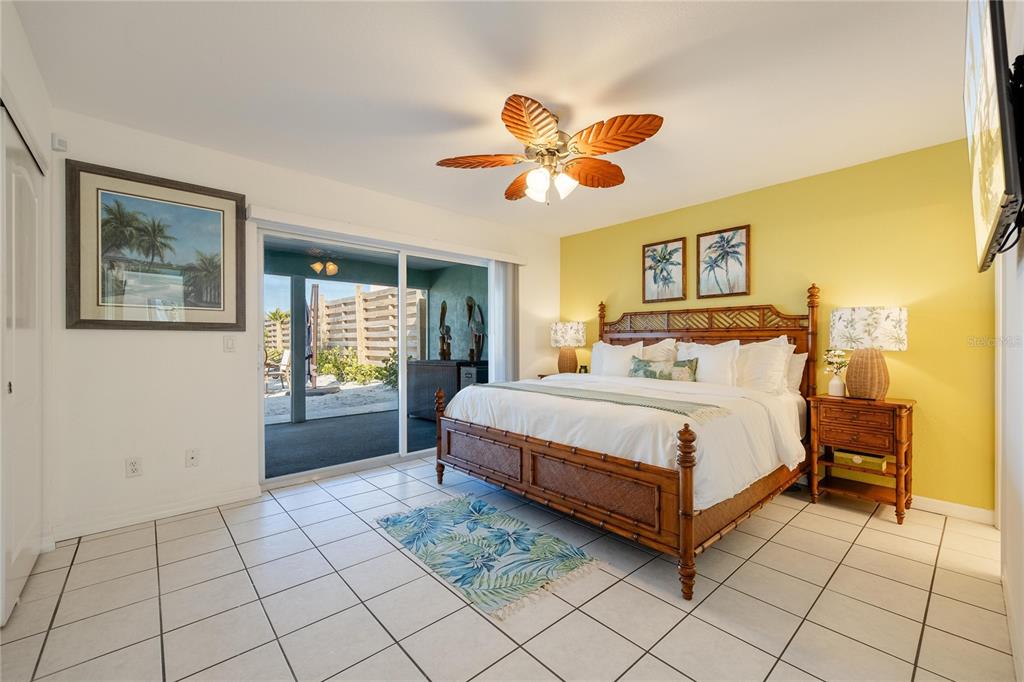 2630 North Beach Road Englewood, FL 34223 - Photo 25 of 98 a spacious bedroom with a bed and a window