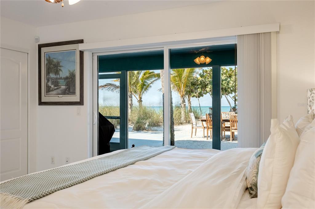 2630 North Beach Road Englewood, FL 34223 - Photo 26 of 98 a bedroom with a bed and a large window