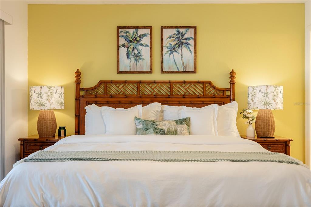 2630 North Beach Road Englewood, FL 34223 - Photo 27 of 98 a bedroom with a bed and painting on the wall