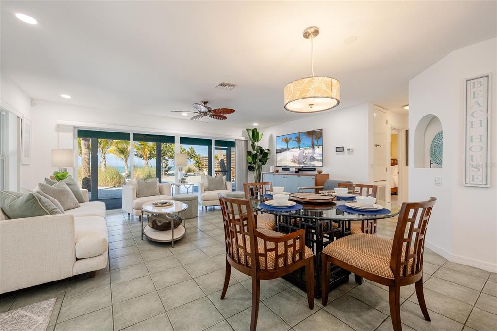 2630 North Beach Road Englewood, FL 34223 - Photo 31 of 98 a view of a dining room with furniture and chandelier