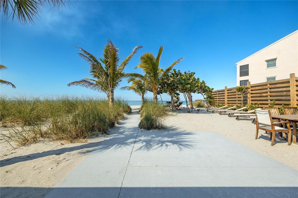 2630 North Beach Road Englewood, FL 34223 - Photo 54 of 98 a view of a palm tree with dinning table and chair