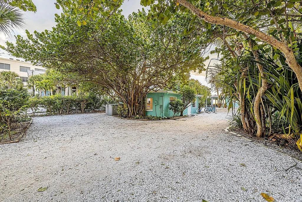 2630 North Beach Road Englewood, FL 34223 - Photo 87 of 98 a view of a yard with a trees