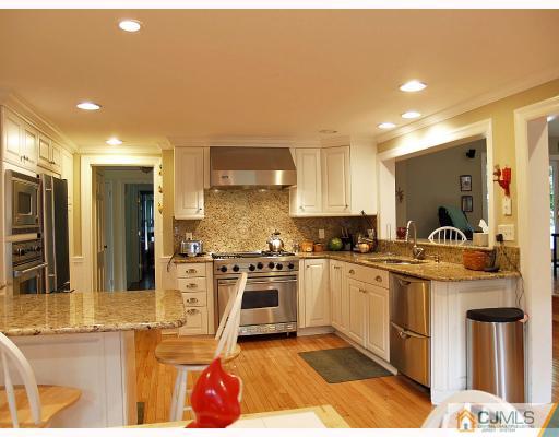 5 Longview Road Edison, NJ 08820 - Photo 4 of 10 a kitchen with stainless steel appliances granite countertop a sink and cabinets