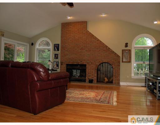 5 Longview Road Edison, NJ 08820 - Photo 5 of 10 a living room with furniture window and a fireplace