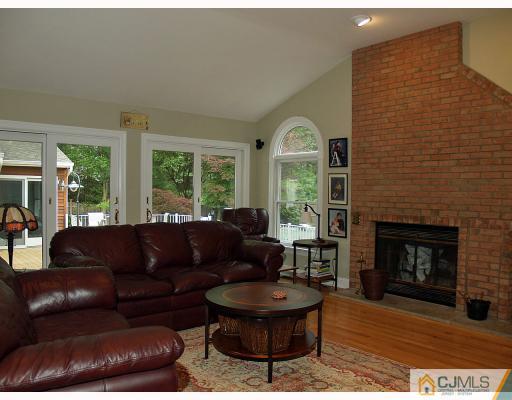 5 Longview Road Edison, NJ 08820 - Photo 6 of 10 a living room with furniture and a fireplace