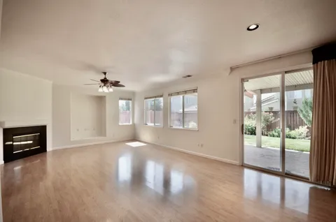 a view of kitchen with stove and cabinets
