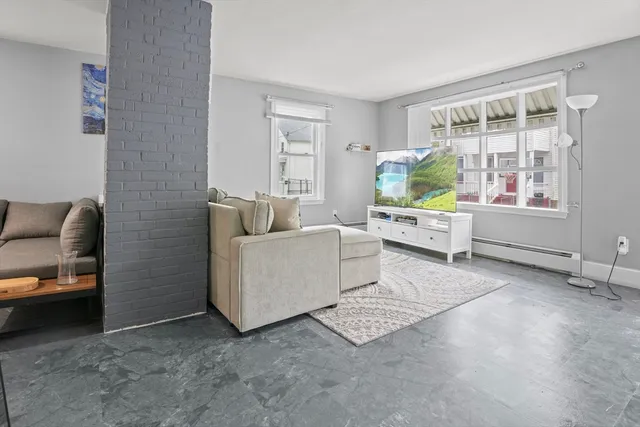 a living room with furniture and a window