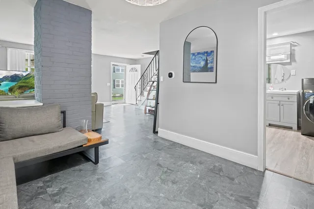 a living room with furniture and a table