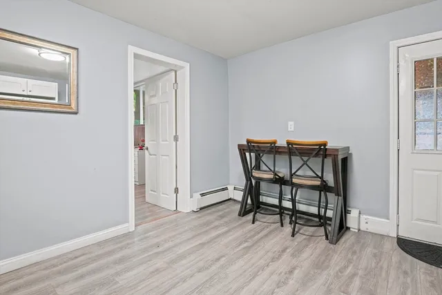 a workspace room with furniture and wooden floor
