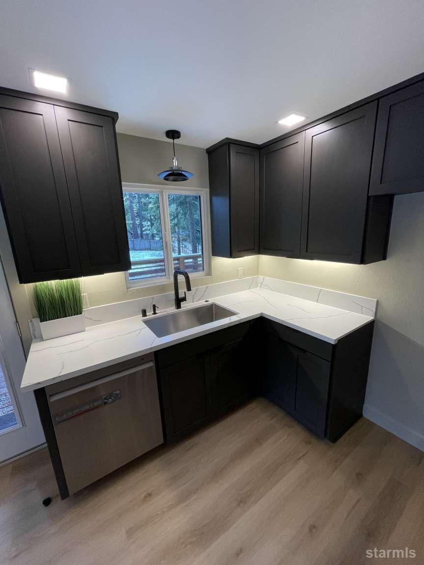 694 Sand Harbor Road South Lake Tahoe, CA 96150 - Photo 12 of 20 a living room with stainless steel appliances kitchen island granite countertop furniture and a large mirror