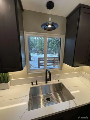 a kitchen with a sink and a window