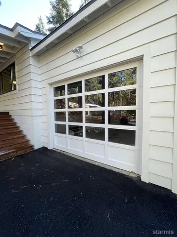 a view of a yard with a tree
