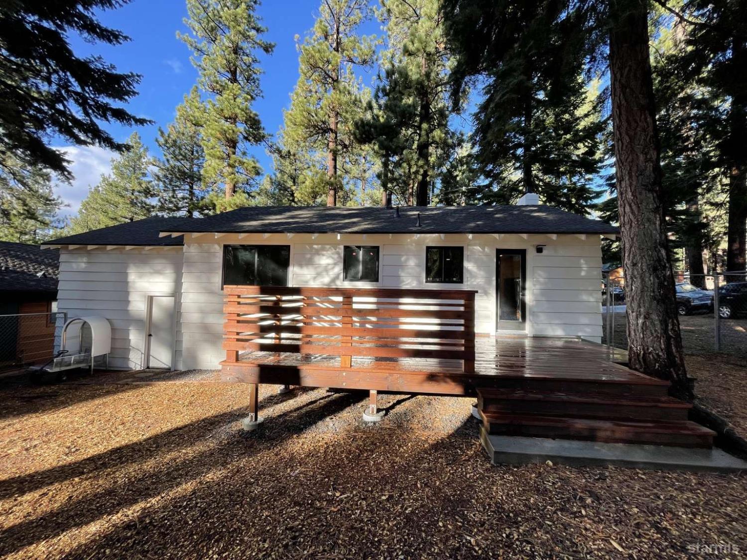 694 Sand Harbor Road South Lake Tahoe, CA 96150 - Photo 4 of 20 a front view of a house with a yard