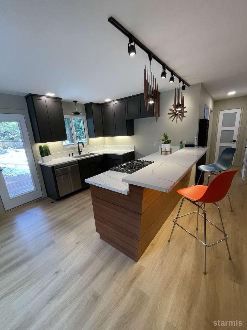 694 Sand Harbor Road South Lake Tahoe, CA 96150 - Photo 7 of 20 a living room with furniture and a flat screen tv