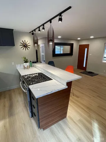 a room with pool table and flat screen tv