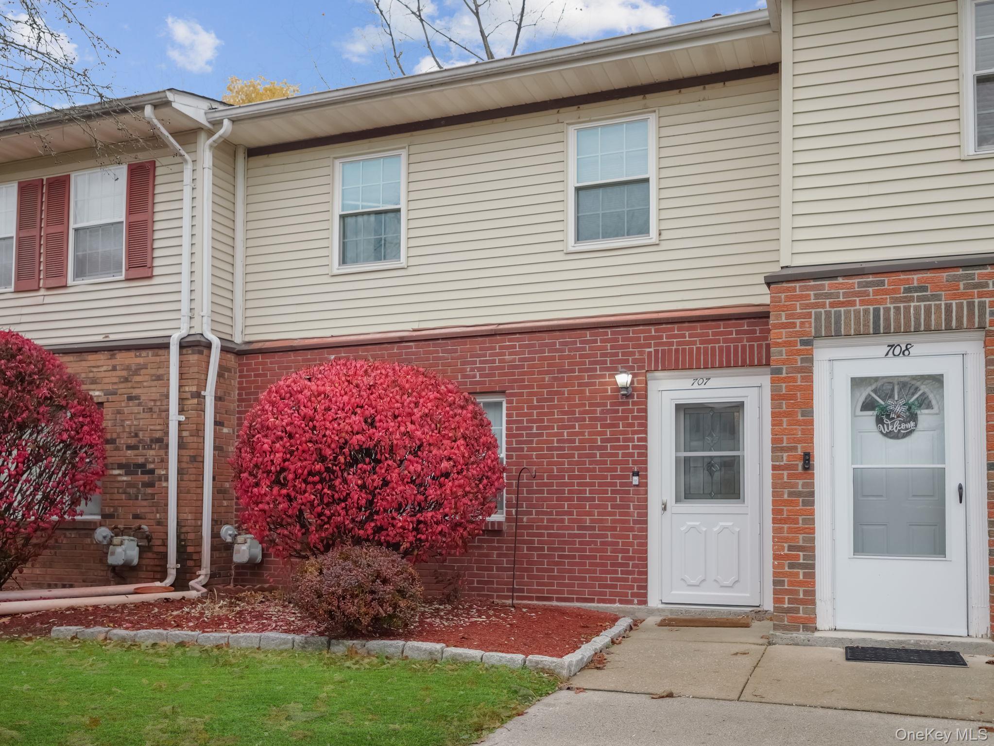 276 Temple Hill Road, Unit 707 New Windsor, NY 12553 - Photo 2 of 23 a front view of a house with garden