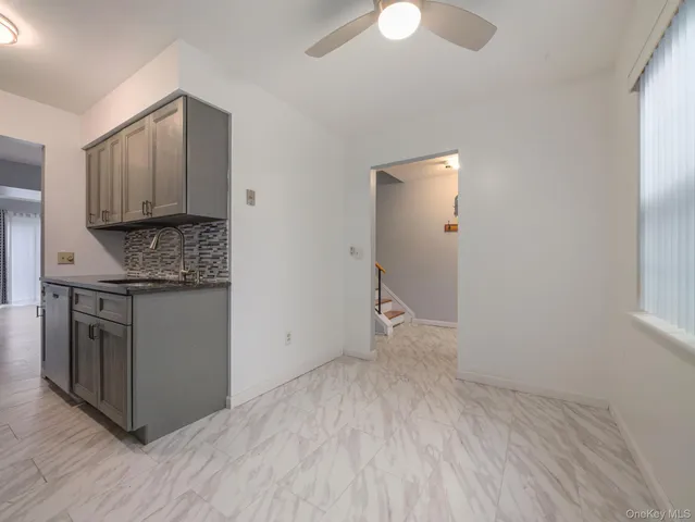 a view of kitchen with granite countertop cabinets and wooden floor