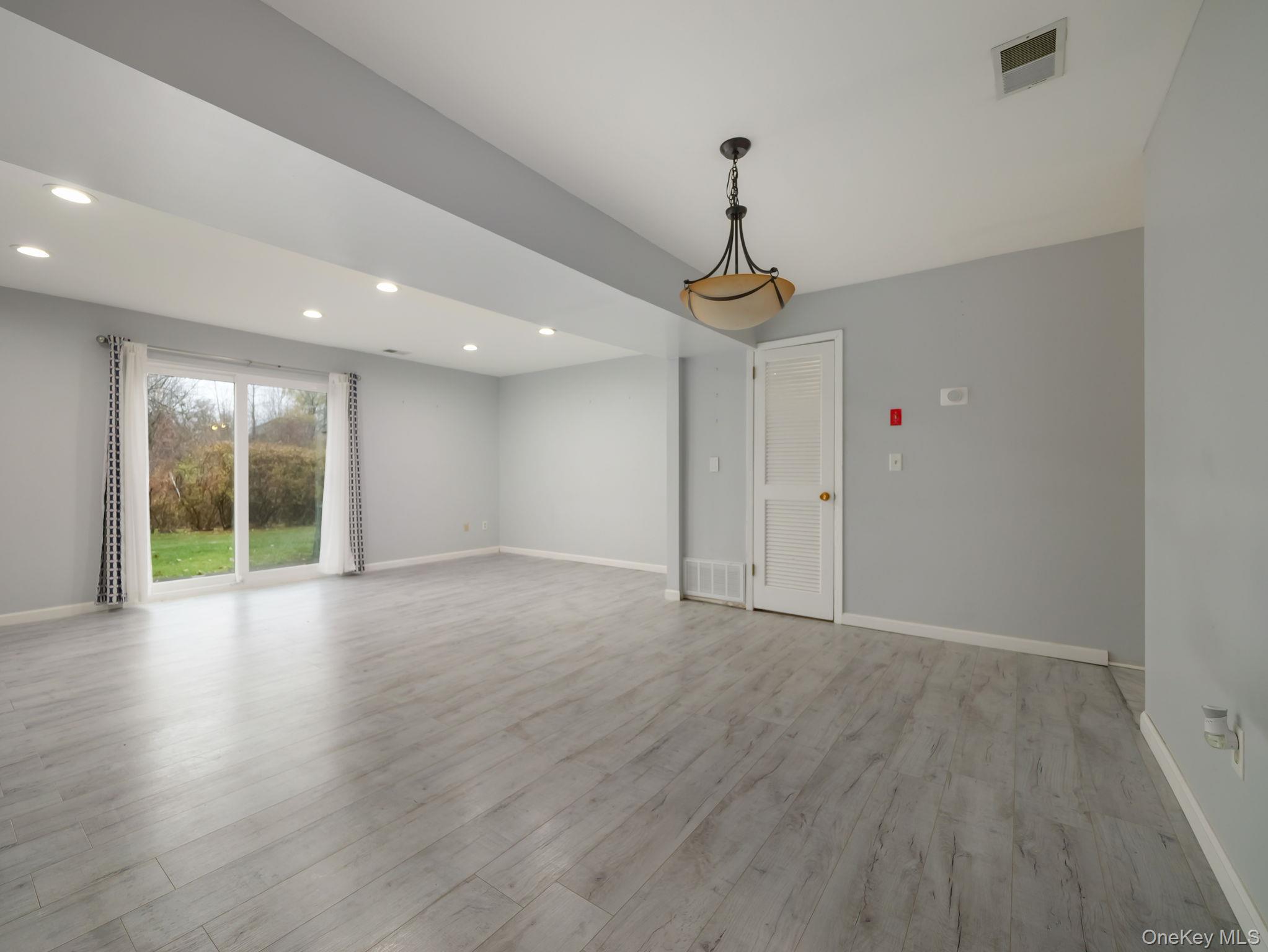 276 Temple Hill Road, Unit 707 New Windsor, NY 12553 - Photo 10 of 23 a view of an empty room with glass door