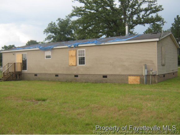 5978 Parkton Road Hope Mills, NC 28348 - Photo 2 of 9 a view of a backyard of the house