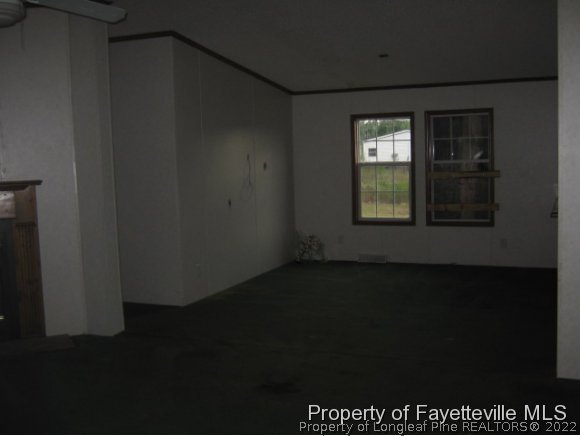 5978 Parkton Road Hope Mills, NC 28348 - Photo 3 of 9 a view of an empty room with a window