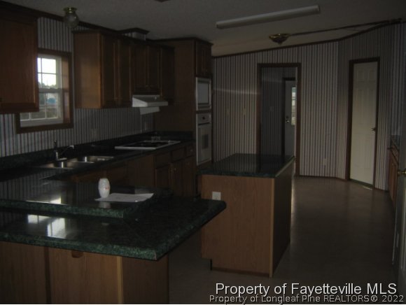 5978 Parkton Road Hope Mills, NC 28348 - Photo 4 of 9 a kitchen with a sink