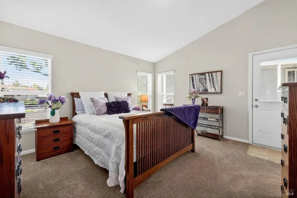 a bed room with a bed and a window