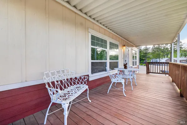 a view of a patio with a table and chairs