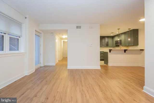 a view of a kitchen with a sink and a stove top oven