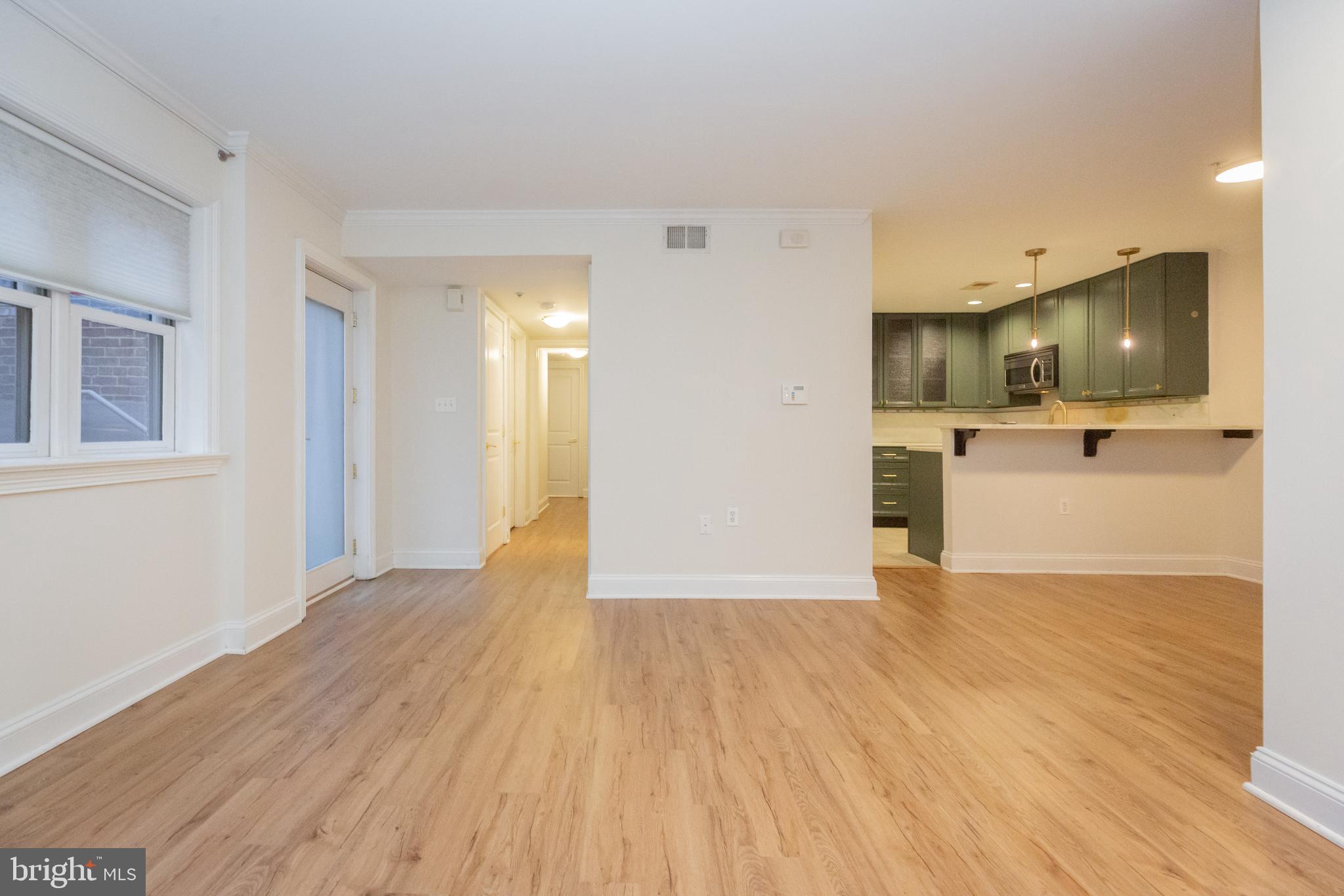 1323 Clifton Street Northwest, Unit 3 Washington, DC 20009 - Photo 13 of 32 a view of a kitchen with a sink and a stove top oven