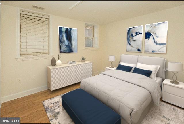 1323 Clifton Street Northwest, Unit 3 Washington, DC 20009 - Photo 14 of 32 a bedroom with a bed and a painting on the wall