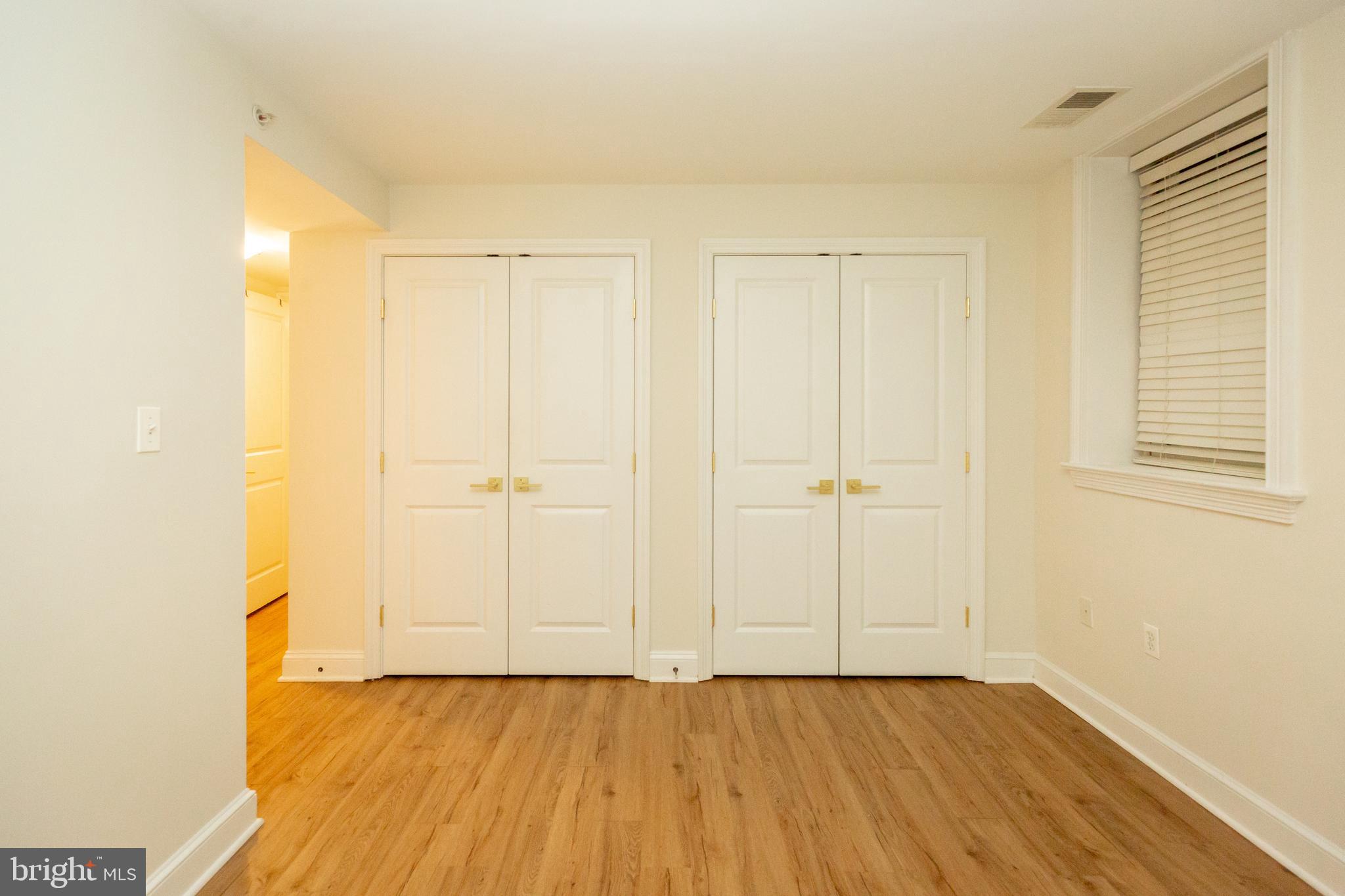 1323 Clifton Street Northwest, Unit 3 Washington, DC 20009 - Photo 15 of 32 a view of an empty room with wooden floor