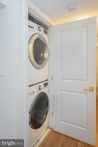 a close view of a utility room with dryer and washer