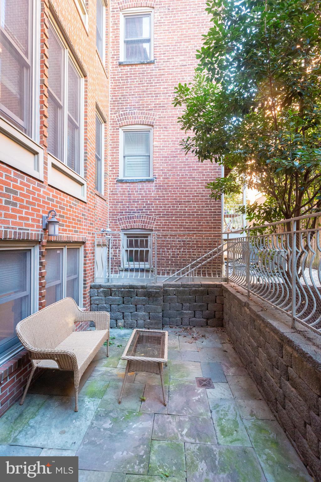 1323 Clifton Street Northwest, Unit 3 Washington, DC 20009 - Photo 26 of 32 a view of a patio with a table and chairs