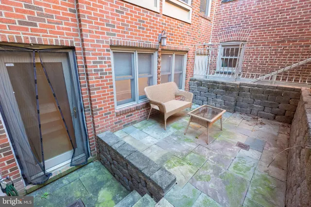 a view of a backyard with table and chairs