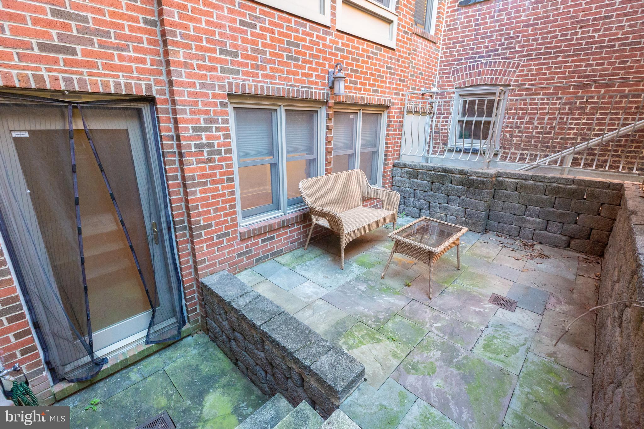 1323 Clifton Street Northwest, Unit 3 Washington, DC 20009 - Photo 27 of 32 a view of a backyard with table and chairs