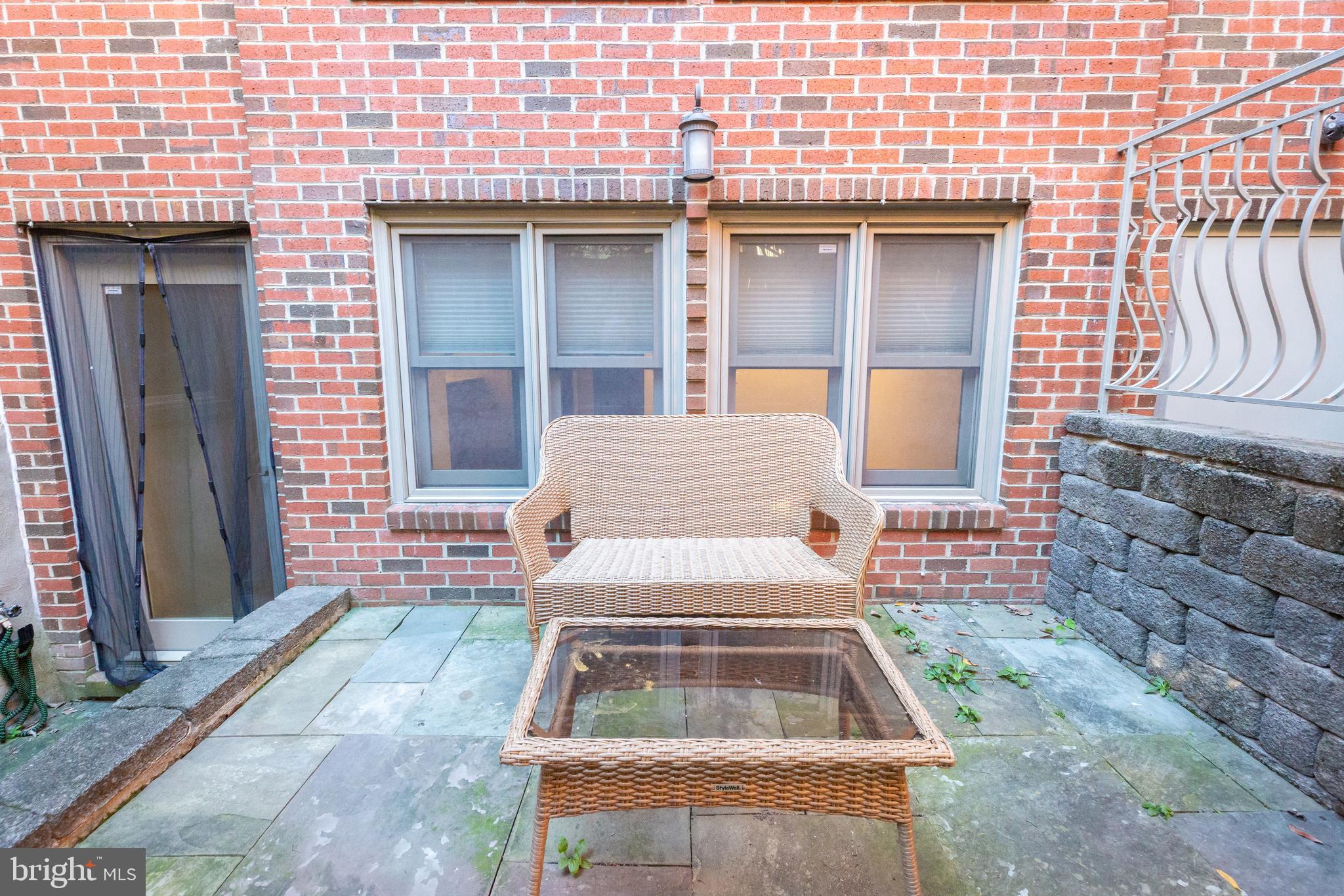 1323 Clifton Street Northwest, Unit 3 Washington, DC 20009 - Photo 28 of 32 a front view of a house with a garden