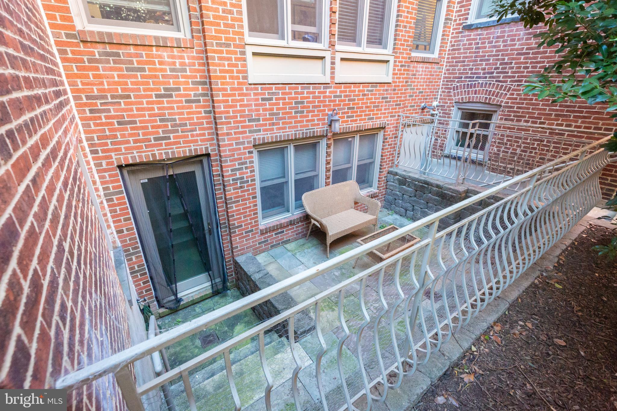 1323 Clifton Street Northwest, Unit 3 Washington, DC 20009 - Photo 30 of 32 a balcony with wooden floor and furniture