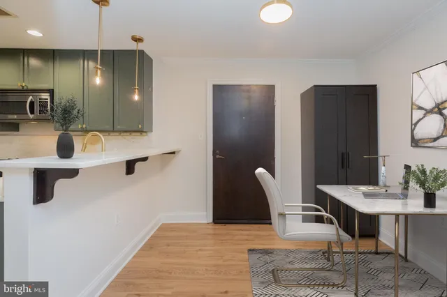 a view of kitchen with furniture and window