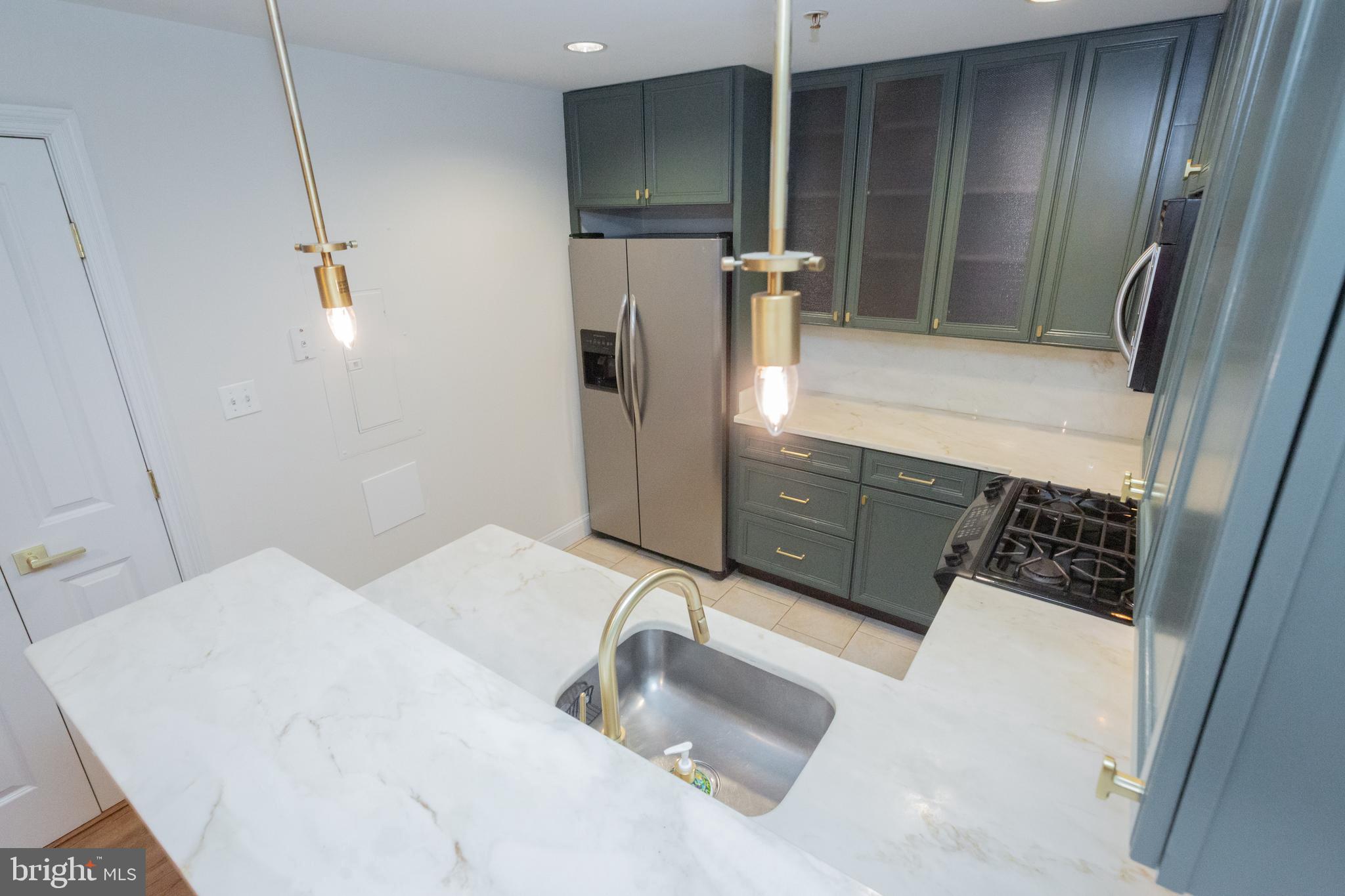 1323 Clifton Street Northwest, Unit 3 Washington, DC 20009 - Photo 9 of 32 a bathroom with a sink and mirror