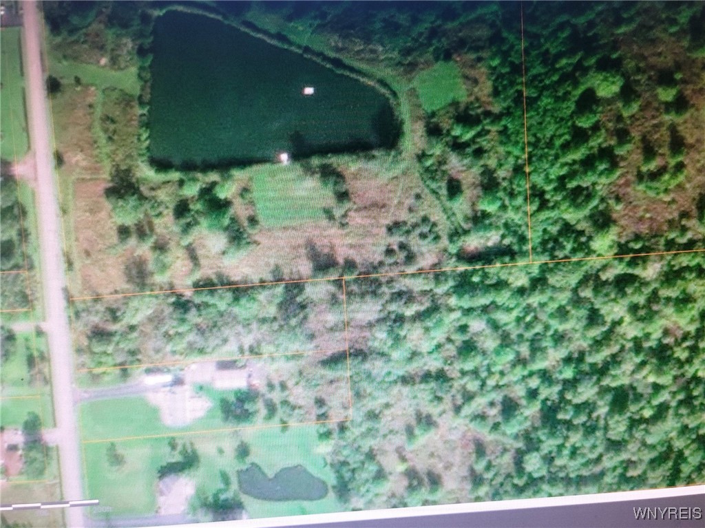 VACANT LOT RIGHT OF LOT WITH POND