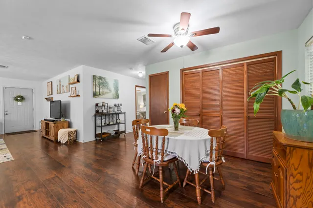 a view of a dining room with furniture window and wooden floor