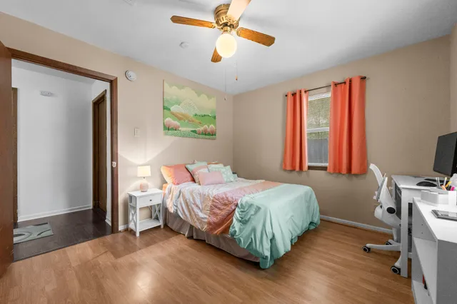 a bedroom with a bed and a window