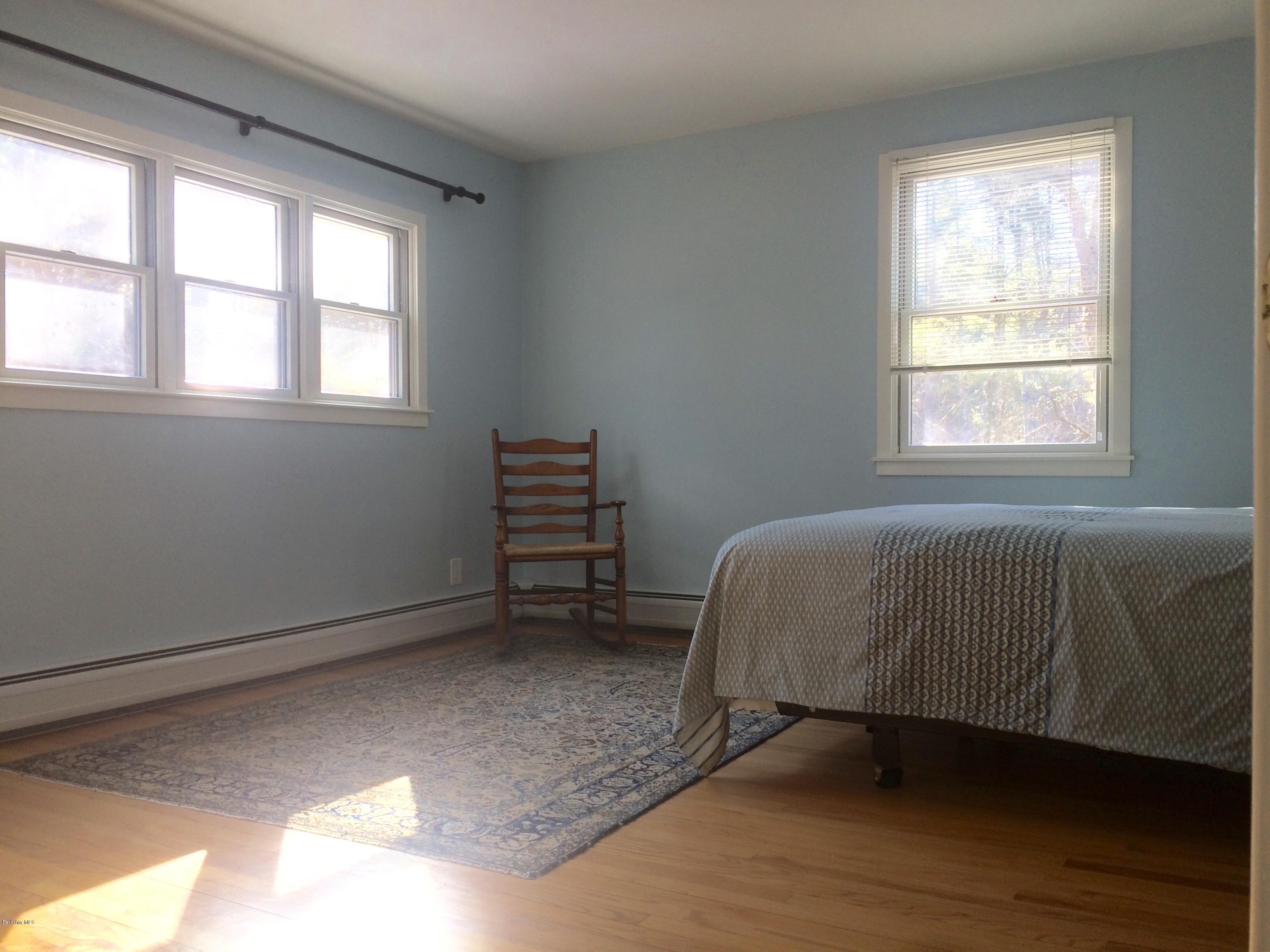 5 Hawthorne Road Lenox, MA 01240 - Photo 14 of 18 a bed sitting in a bedroom next to a window