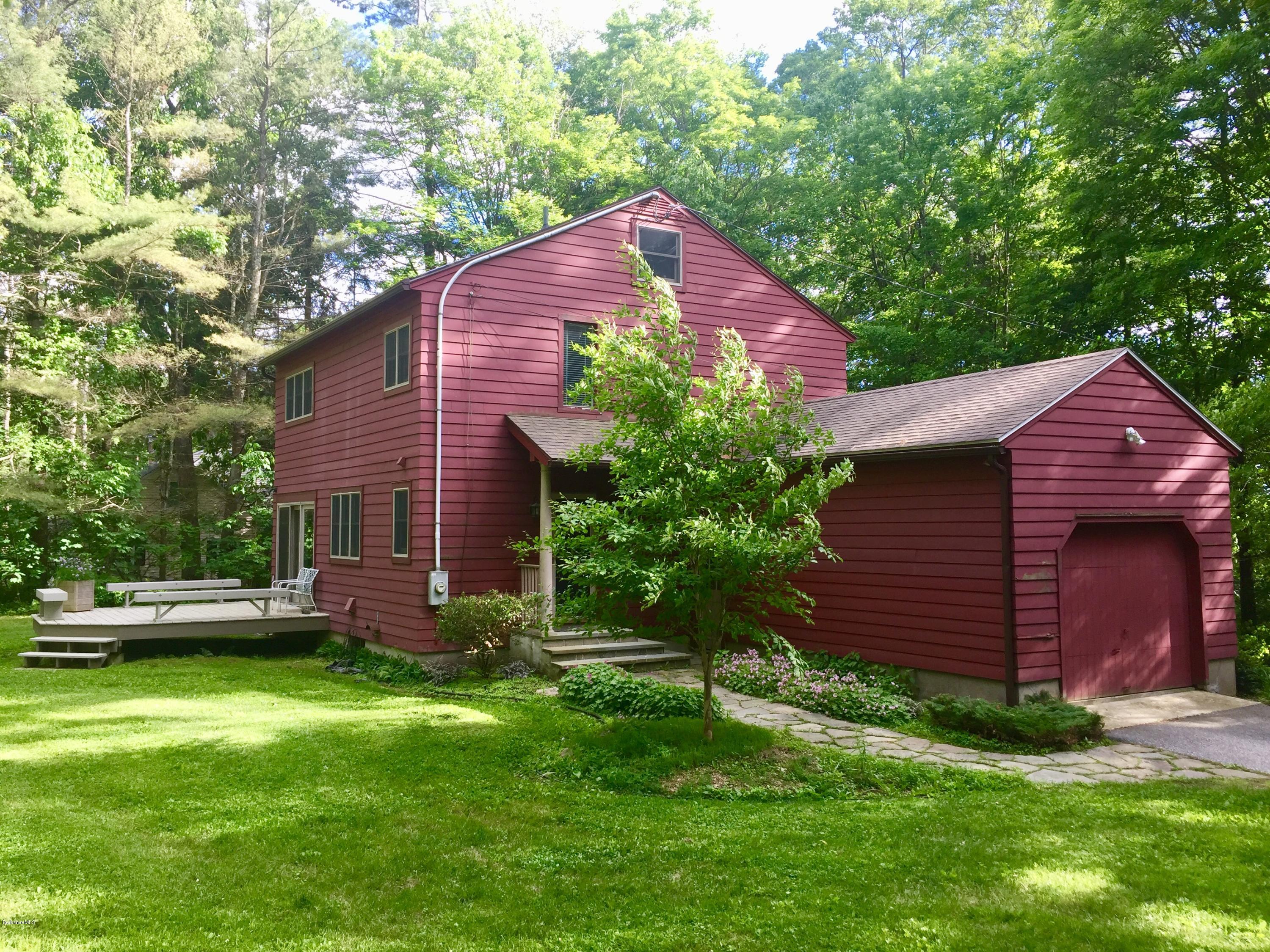 5 Hawthorne Road Lenox, MA 01240 - Photo 17 of 18 a view of a yard in front of a house with plants and large tree